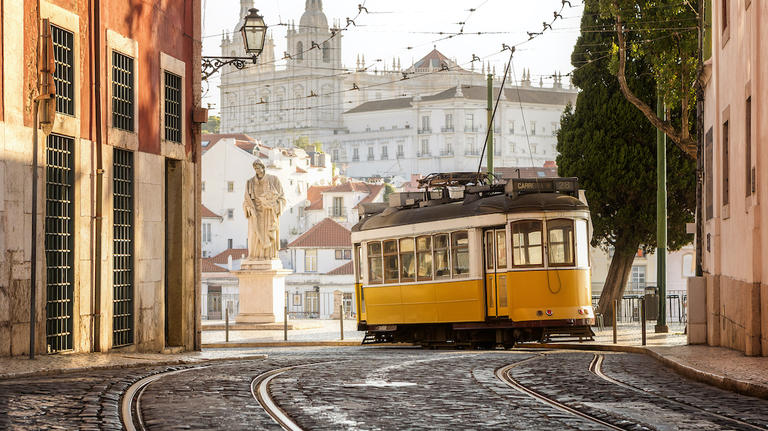 Traditional yellow tramway in Lisbon. 