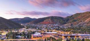 view of park city in valley at sunset